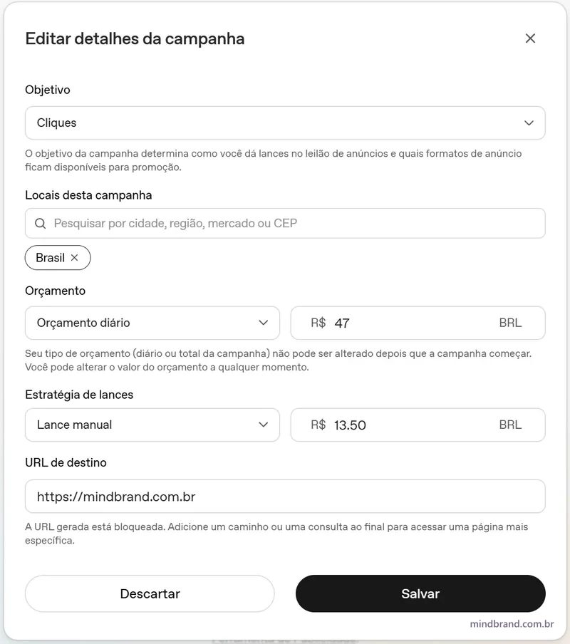 Tela de edição da campanha no Ads Manager: objetivo Cliques, local Brasil, orçamento diário de R$ 47, lance manual de R$ 13,50 e aviso de que a URL da página inicial está bloqueada